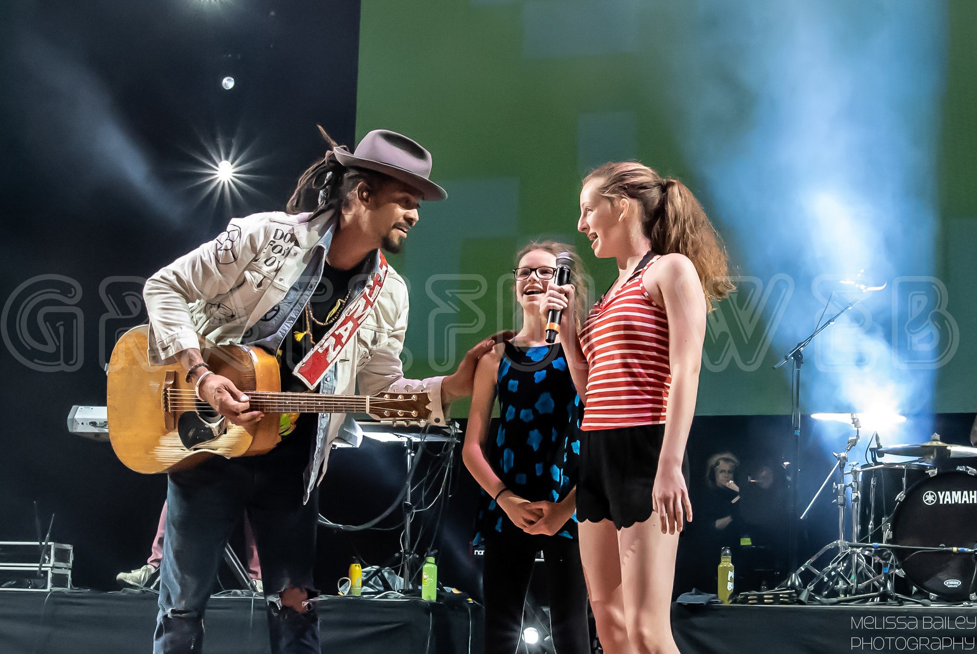 Michael Franti introduces some wonderful young singers to the stage