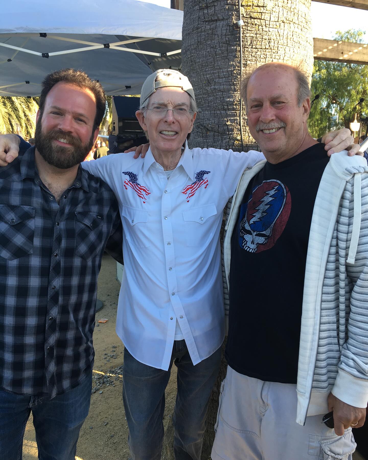 personal photo of Cris, Phil, and his dad