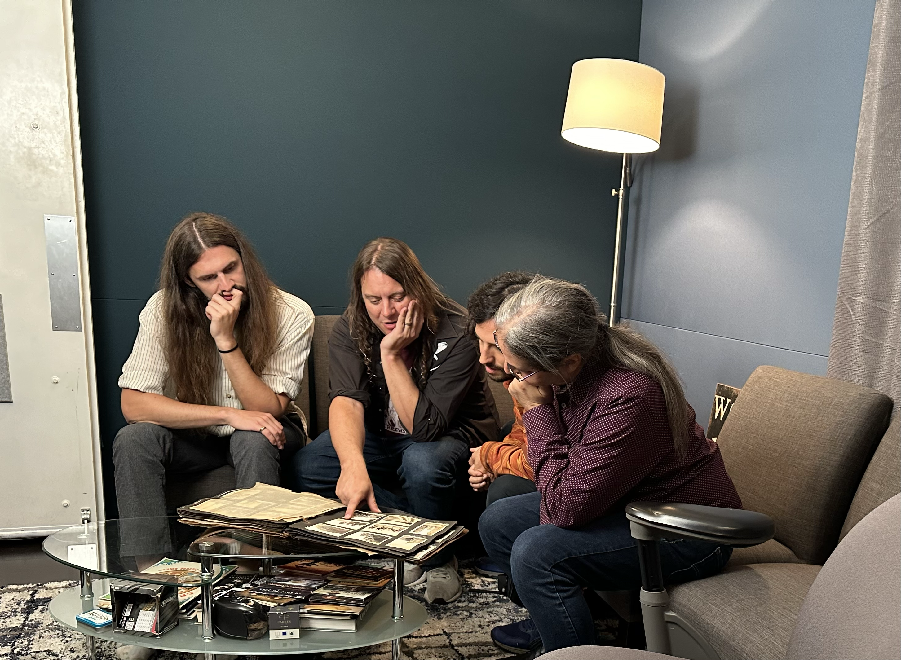 Henhouse Prowlers at Dark Shadow Recording studio,  looking at the photo album from Ben's Grandfather's memorabilia, that inspired Ben to write Line The Avenues. (L-R: Jake Howard, Ben Wright, Chris Dollar, Jon Goldfine). Photo by Jana Mougin.