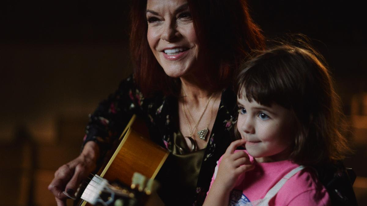 Above: Rosanne Cash pictured with her granddaughter Olive at the Country Music Hall of Fame.