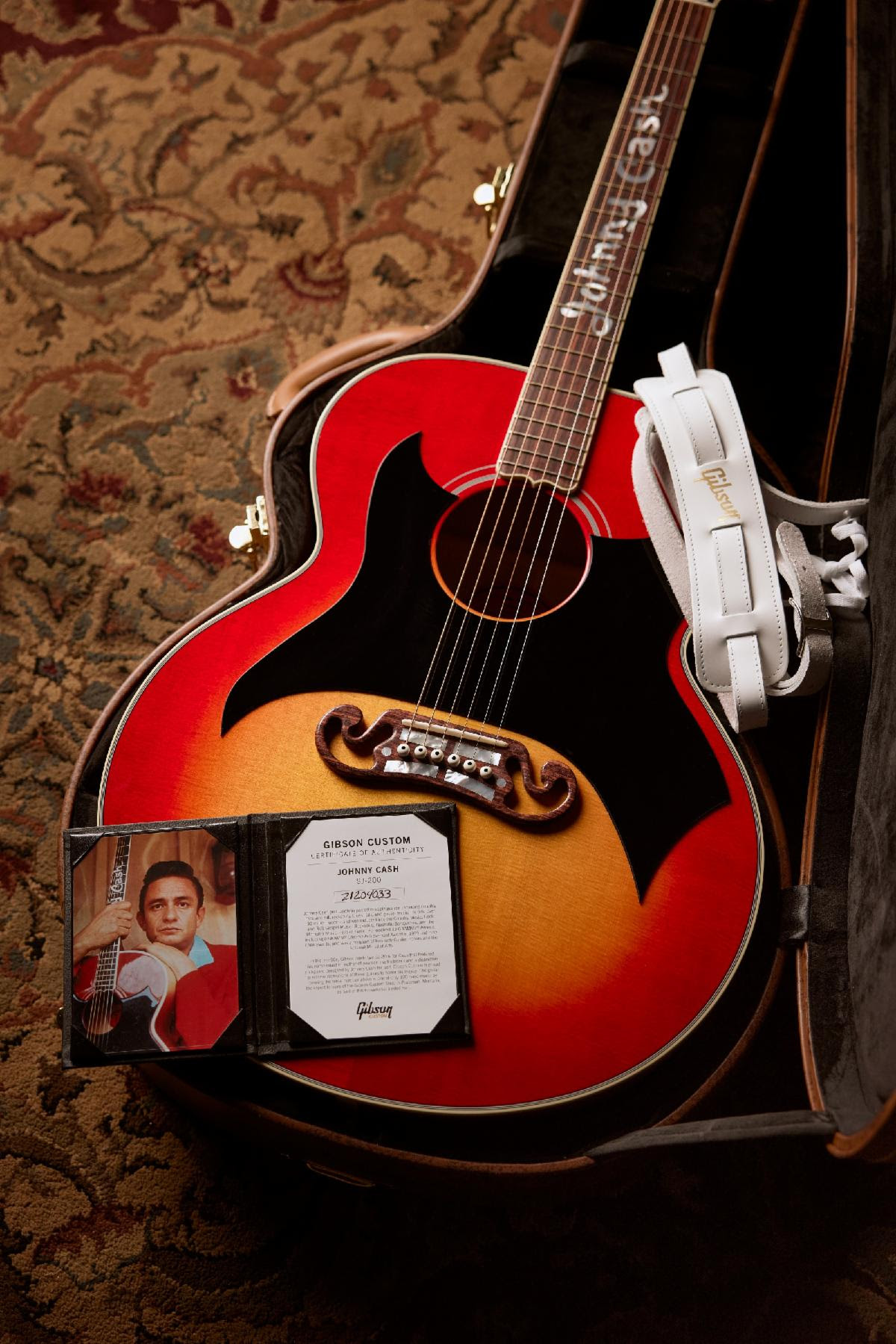 Above: Johnny Cash SJ-200 from Gibson Custom, pictured with exclusive hardshell case, guitar strap and Certificate of Authenticity.